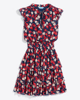 The Alana Tiered Dress in Stretch Mesh by Draper James is a sleeveless navy mini dress featuring red, white, and pink florals, a ruffled neckline, fitted waist, and layered skirt.