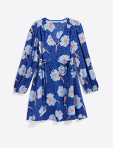 The Draper James Kellie Babydoll Dress in Printed Dot Jacquard features a blue long-sleeve design with light blue and orange floral print, V-neckline, waist tie, dot jacquard texture, and puffed sleeves against a white background.
