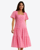 The Draper James Caitlyn Midi Dress in Eyelet offers a pink lace design with short sleeves and a charming square neckline, crafted from delicate cotton eyelet fabric.