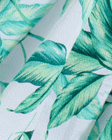 Close-up of Draper James' Midi Skirt in Hammered Satin, showcasing light blue hammered satin with a green leafy patternâ€”ideal for breezy looks or comfy smocked-waist styles.