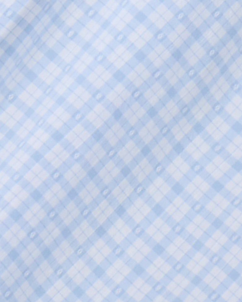 Soft light blue and white gingham check fabric with a subtle dotted pattern—ideal for creating a charming women's Tie Waist Romper from Draper James.