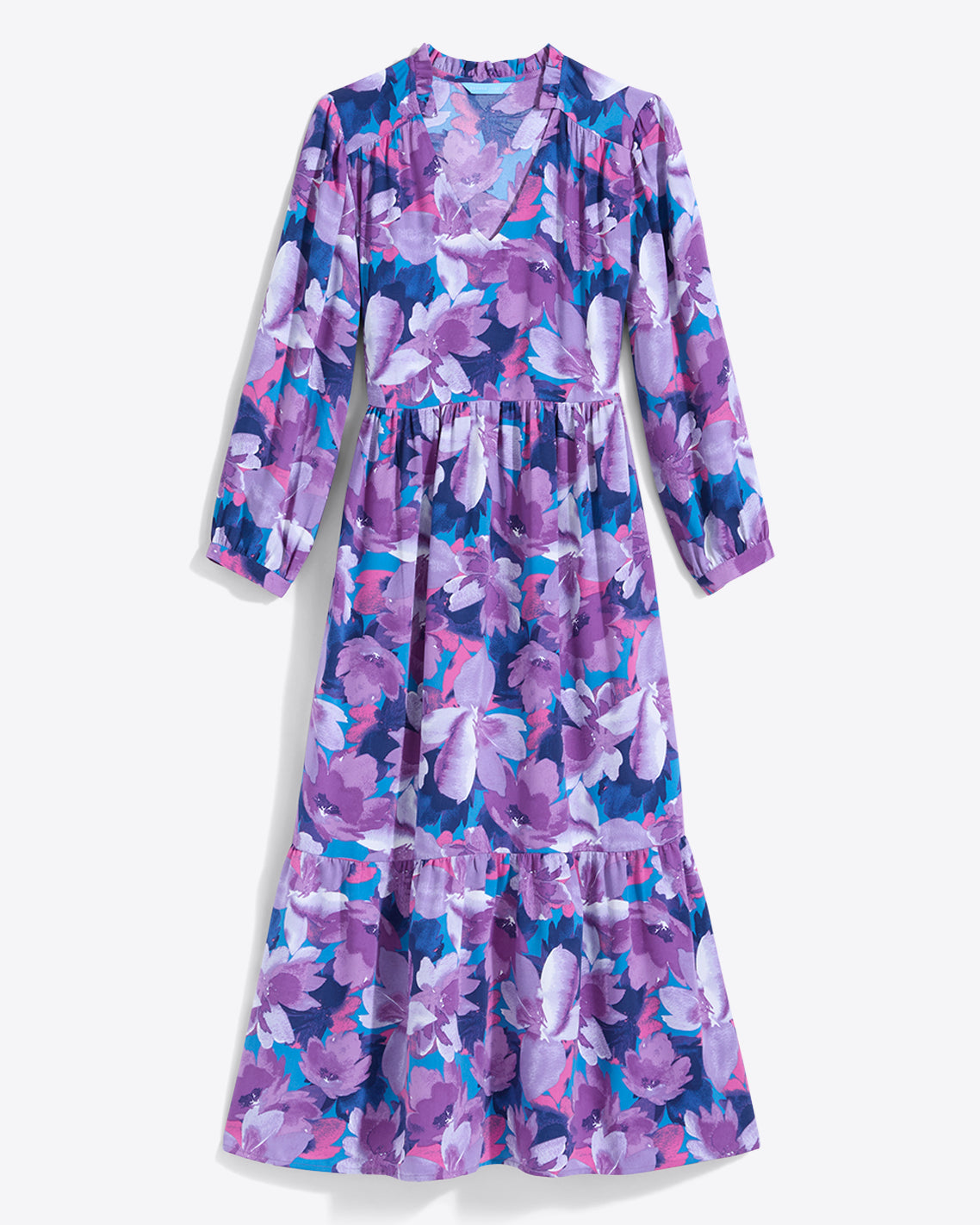 The Draper James Katie Midi Dress boasts a crewneck with a center front keyhole, vibrant floral fabric featuring purple, pink, and white flowers on blue, long sleeves, and a ruffled hem for elegance.