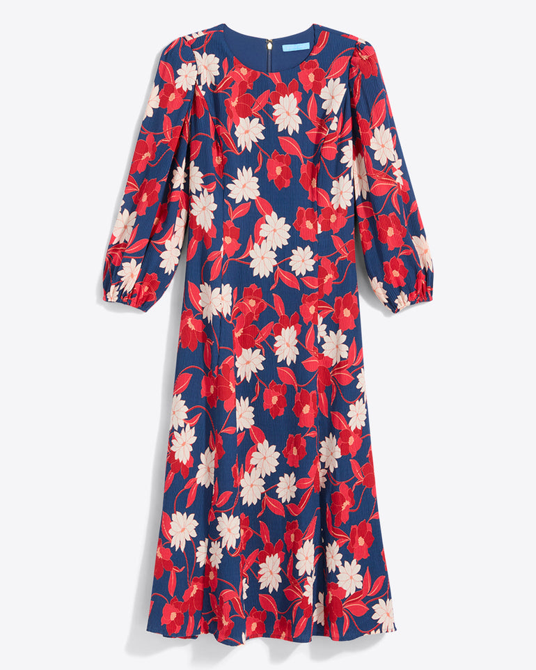 The Draper James Matilda Midi Dress in Crinkle PlissÃ© features long sleeves and a knee-length blue base with red and white floralsâ€”an elegant choice for work.
