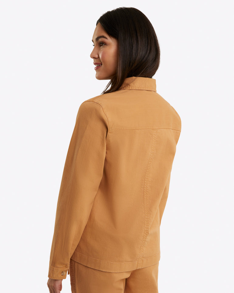 In a side view against a plain background, an individual is wearing Draper James' Utility Jacket in Cotton Twill.