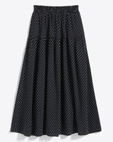 The Draper James Midi Skirt in Polka Dot features a black base with white dots, an ankle-length cut, and a comfy smocked waist for easy wear.