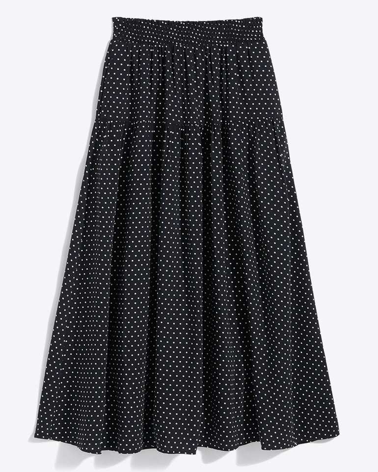The Draper James Midi Skirt in Polka Dot features a black base with white dots, an ankle-length cut, and a comfy smocked waist for easy wear.