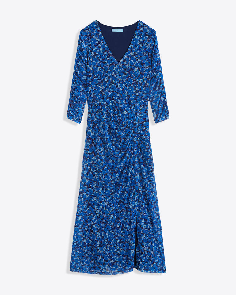 The Selena V-Neck Midi Dress in Blue Scattered Ditsy by Draper James features three-quarter sleeves and a side slit, made from floral-printed stretch mesh and shown on a white background.