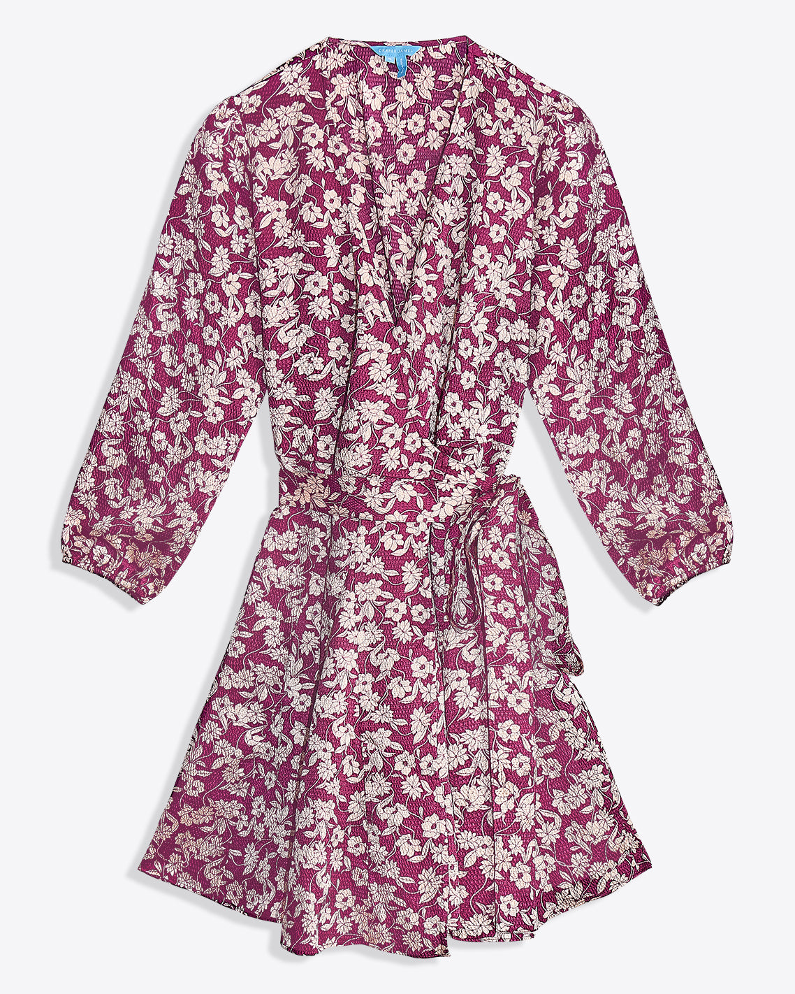 The Jordan Long-Sleeve Wrap Dress in Hammered Satin by Draper James features a pink base with white floral print, knee-length cut, wrap front, long sleeves, and a matching fabric waist tie.