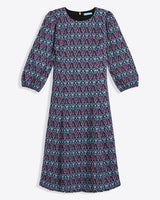 The Draper James Long-Sleeve Midi Dress features a knee-length crinkle chiffon design with multicolored paisley in blue, pink, and black, plus a crewneck and slightly puffed sleeves.