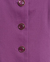 Close-up of the textured purple fabric from the Draper James Hannah Shift Dress in Amethyst, featuring three round purple buttons arranged vertically on its classic silhouette.