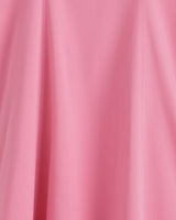 Close-up of the smooth pink fabric with soft folds and subtle seams from the Genevieve Square Neck Sleeveless Midi Dress by Draper James.