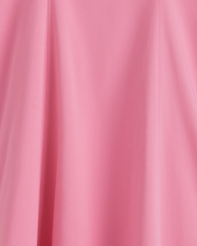 Close-up of the smooth pink fabric with soft folds and subtle seams from the Genevieve Square Neck Sleeveless Midi Dress by Draper James.