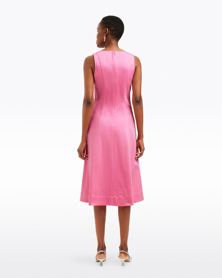A person, facing away, wears the Draper James Genevieve Square Neck Sleeveless Midi Dress in pink with knee-length and white heeled shoes, set against a plain white background.