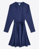 The Imogen Mini Shirtdress by Draper James features navy blue cotton, long sleeves, front buttons, a V-neckline, and a matching belt at the waistâ€”perfect as a chic work dress.
