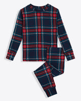The Draper James Kids Crewneck Pajama Set in Georgia Plaid features a festive long-sleeve top and pants with red, blue, and white stripes, making it the perfect cozy ensemble to keep kids snug through the night during the holidays.