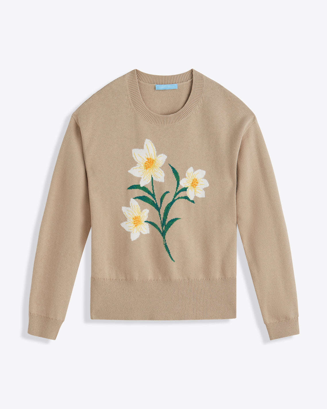The Draper James Daffodil Crewneck Sweater is a beige long-sleeve cotton-wool blend featuring a large white and yellow daffodil with green stems on the front.