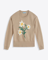 The Draper James Daffodil Crewneck Sweater is a beige long-sleeve cotton-wool blend featuring a large white and yellow daffodil with green stems on the front.