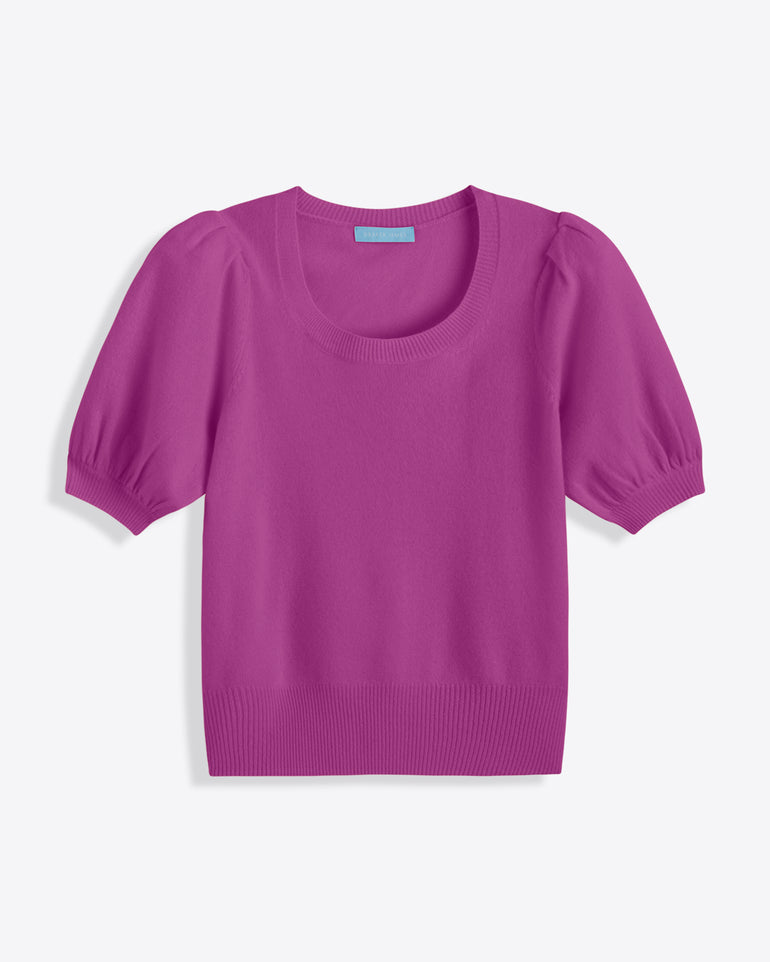 The Draper James Short Sleeve Cashmere Sweater in bright magenta pink features a scoop neckline, puffed sleeves, and ribbed hem, shown laid flat on a white background.