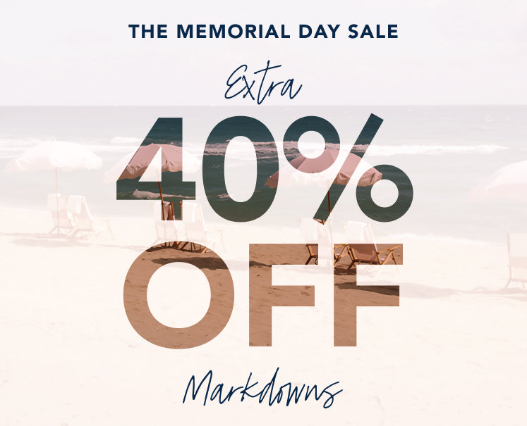 Memorial Day sale advertisement with 40% off markdowns on a blurred beach background.